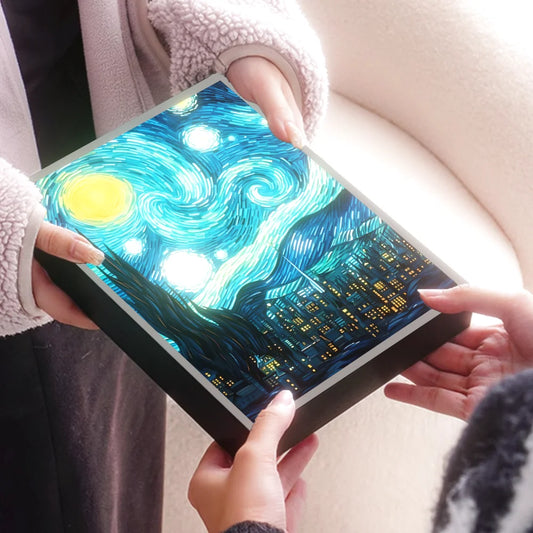 Starry Night LED artistic night light by WinniHouse inspired by Van Gogh, showcasing a vibrant starry sky scene with warm illumination.