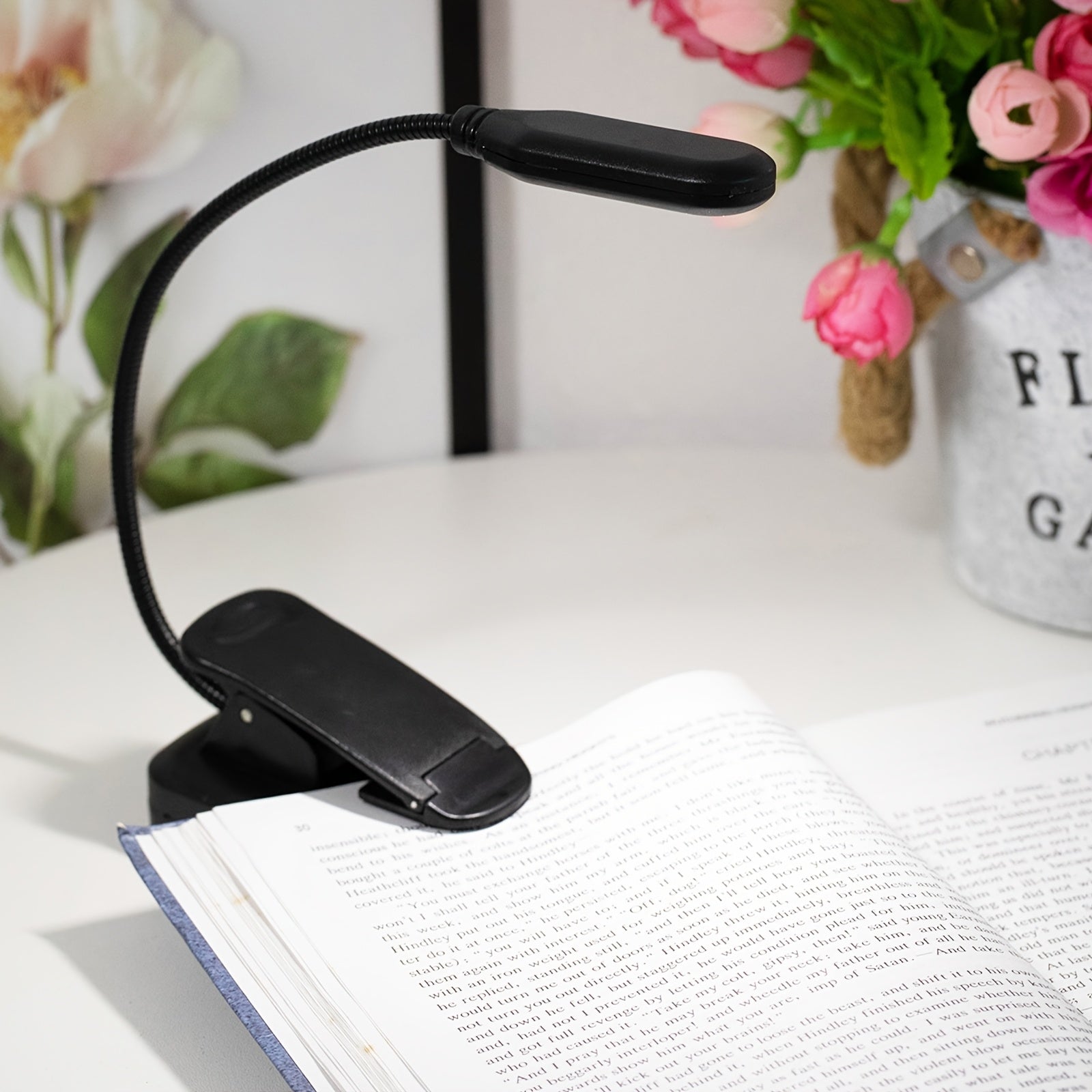WinniHouse LED desk lamp with adjustable arm and clip, battery-powered, ergonomic design ideal for reading and workspace lighting.