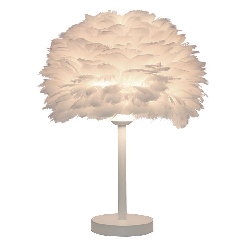 WinniHouse feather table lamp with artistic design, ideal for bedroom decor, featuring a soft feather shade and elegant base.
