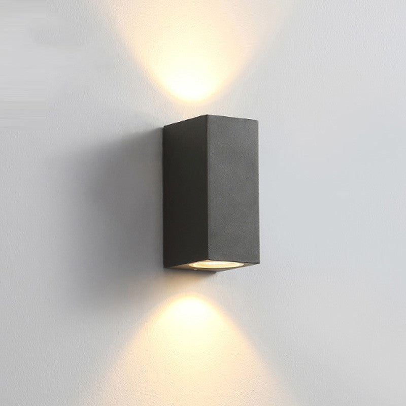 Modern wall lamp by WinniHouse with sleek design and adjustable arm, suitable for living rooms and bedrooms.