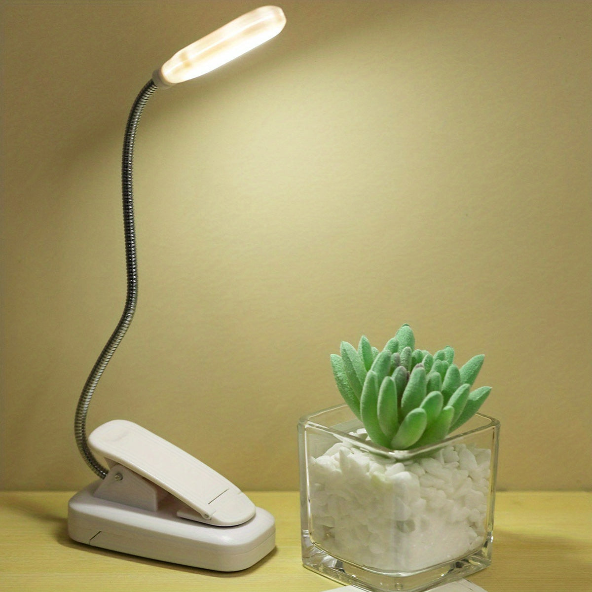 WinniHouse LED desk lamp with adjustable arm and clip, battery-powered, modern minimalist design for reading and workspace illumination.