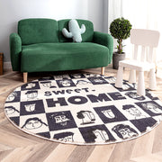 Round artistic white and black rug with modern illustrated design, ideal for contemporary home decor by WinniShop.