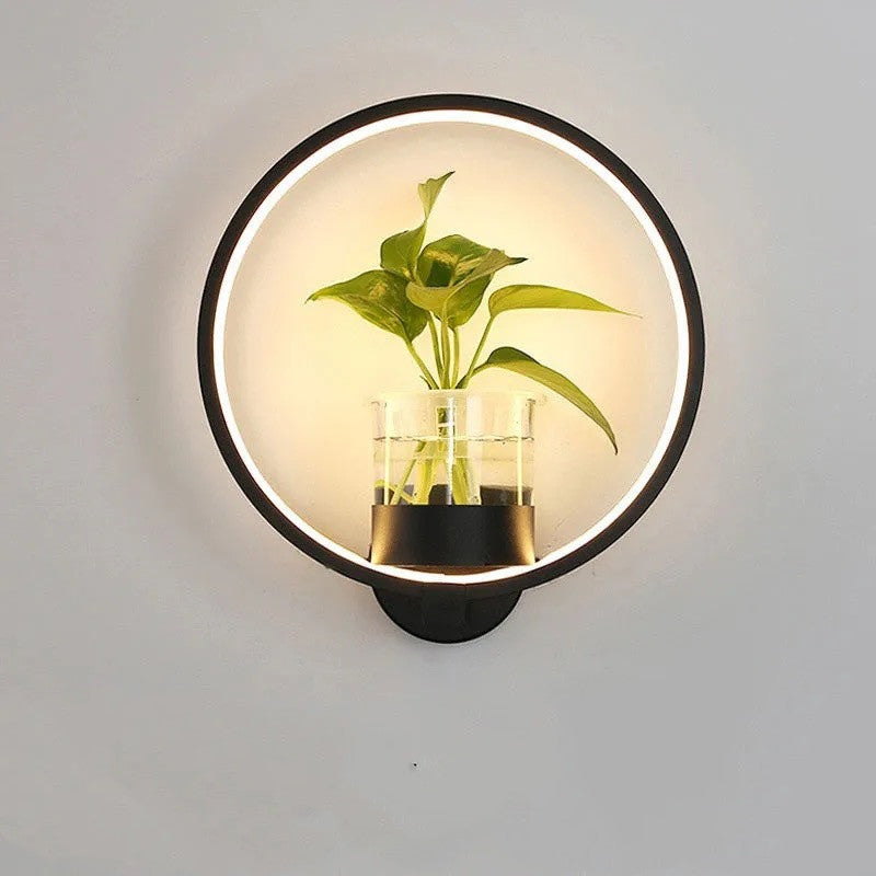 Decorative wall lamp by WinniHouse mounted on a background wall, featuring a modern design with a warm light glow.