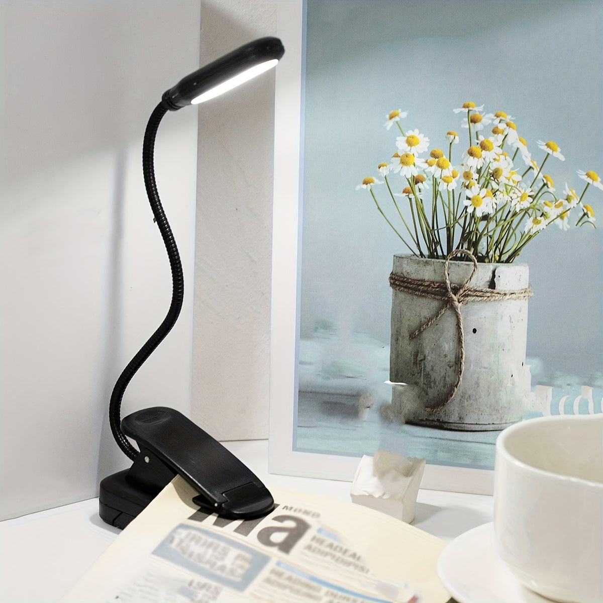 WinniHouse LED desk lamp with adjustable arm and clip, battery-powered, modern ergonomic design for reading and home or office lighting.