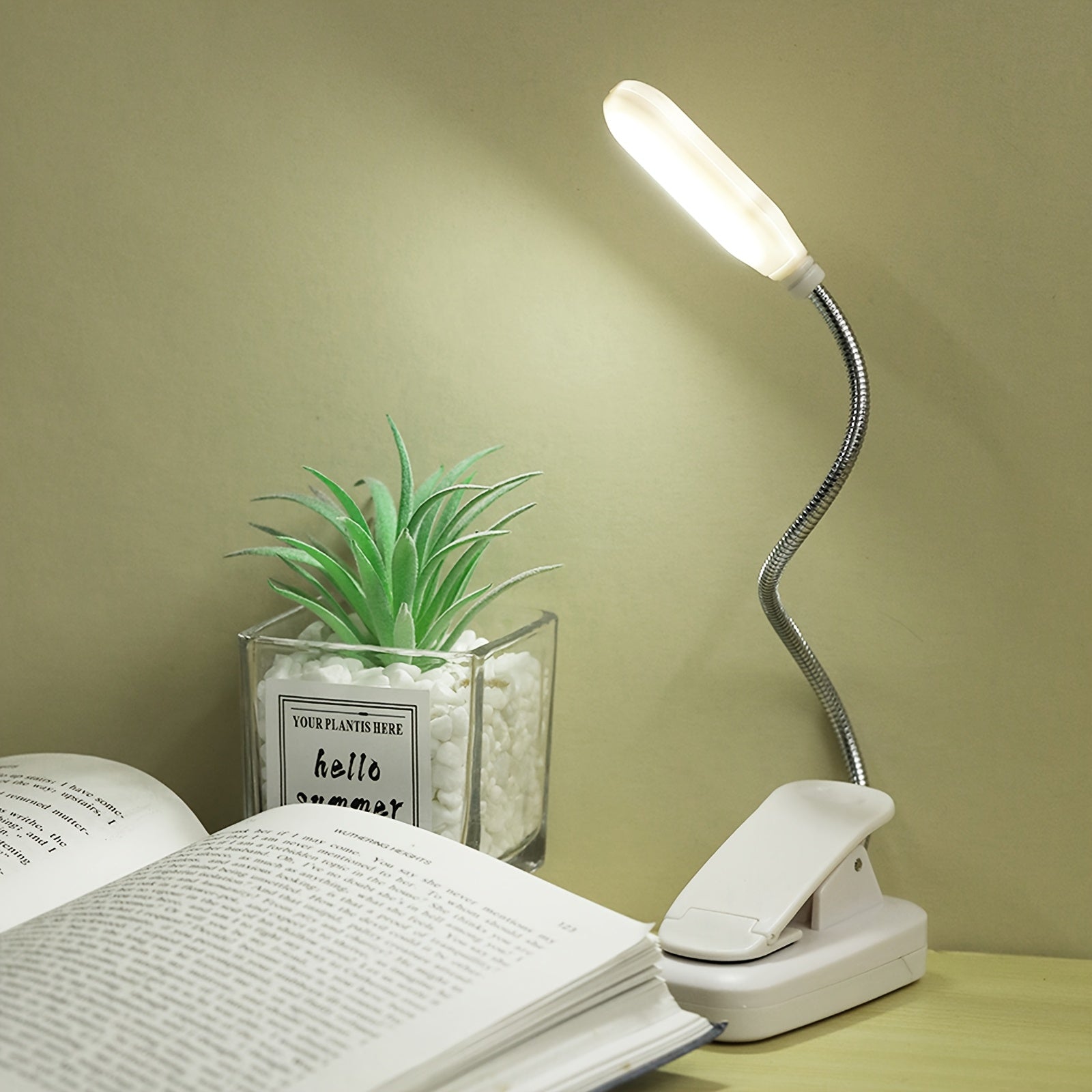 WinniHouse LED desk lamp with adjustable arm and clip, battery-powered, modern ergonomic design for reading at bed or office.