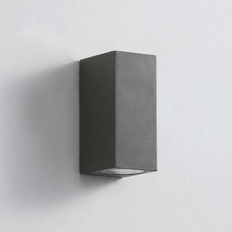 Modern wall lamp by WinniHouse with a sleek design and adjustable arm, mounted on a neutral-colored wall.