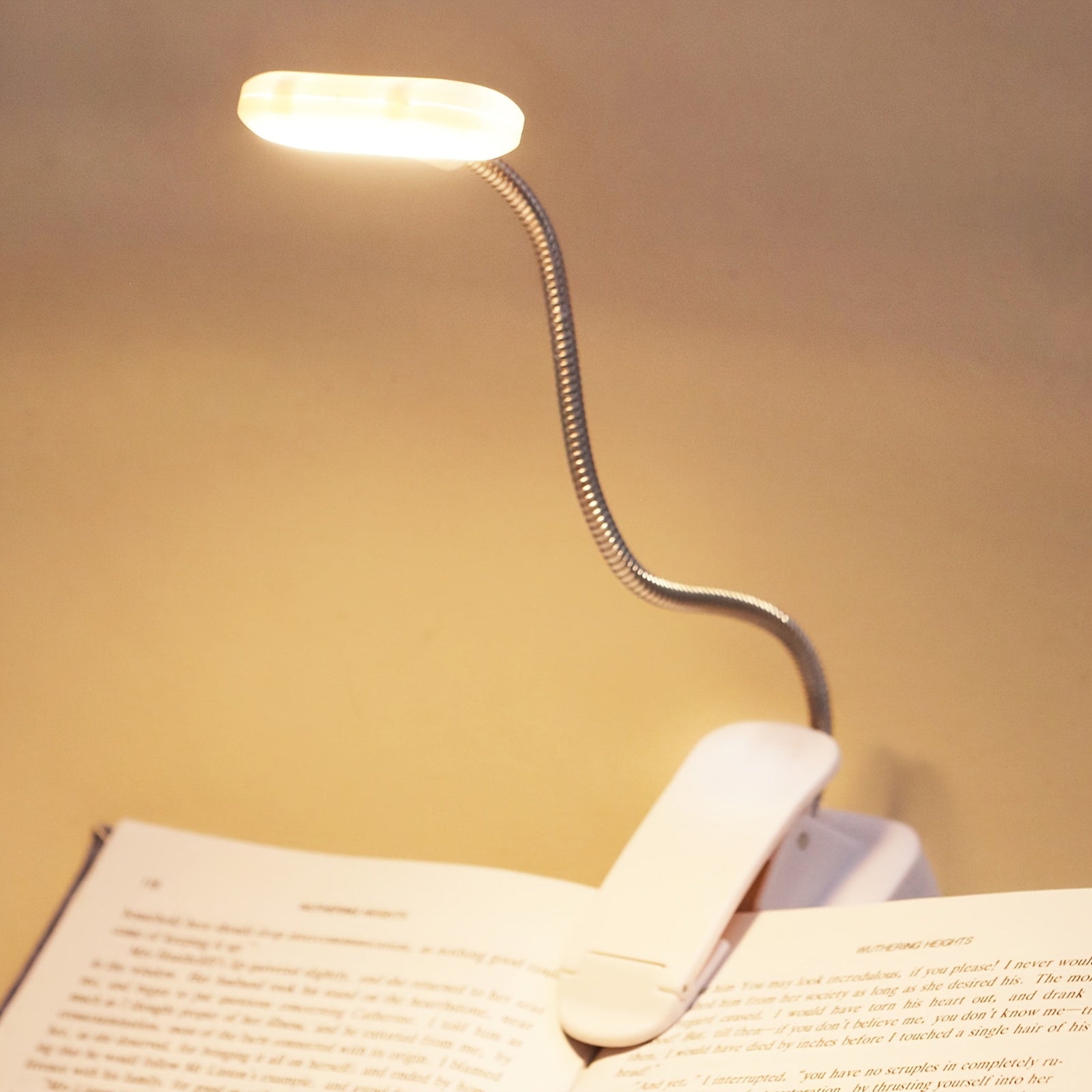 WinniHouse LED desk lamp with adjustable arm, clip, and battery-powered button for reading and work in modern, ergonomic design.