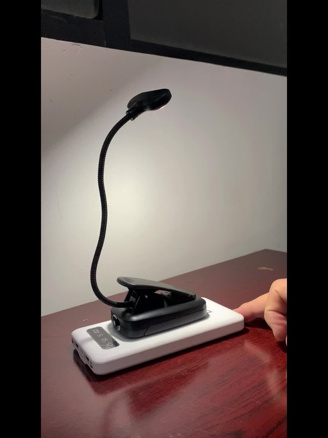WinniHouse LED desk lamp with adjustable arm, clip, battery, and push button for reading and workspace illumination.