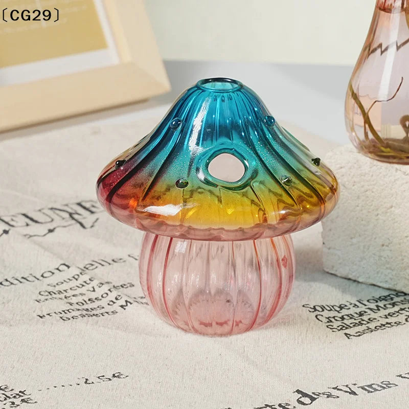Colorful glass mushroom-shaped vase by WinniHouse, featuring vibrant hues and a glossy finish.
