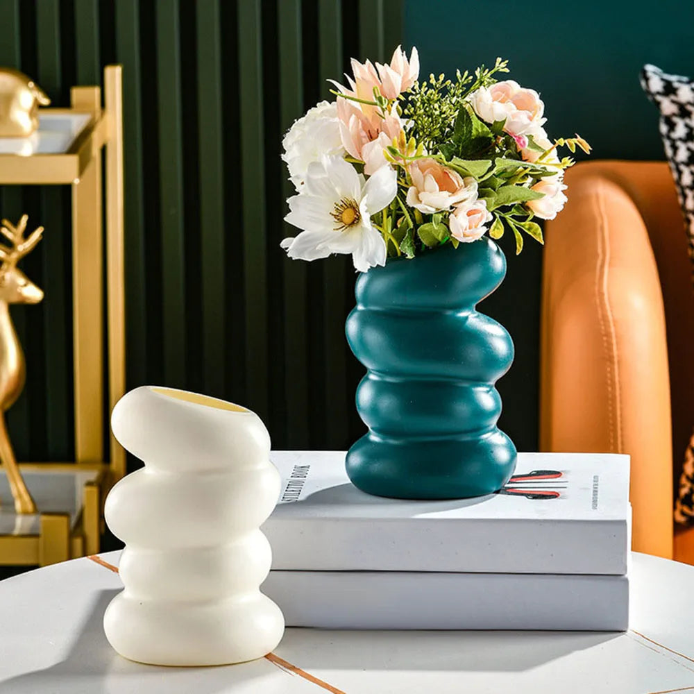 Modern Nordic flower vase from WinniHouse, stylish bedroom decor with a sleek design and vibrant floral arrangement.