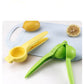 WinniHouse manual portable lemon and orange juicer, compact kitchen tool for fresh juice extraction, resting on a white surface.