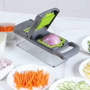 Portable WinniHouse vegetable chopper with multiple blades and compact design for efficient vegetable preparation.
