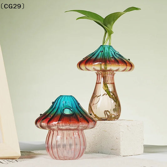 Colorful glass mushroom-shaped vase by WinniHouse, featuring vibrant hues and a whimsical design for decorative display.