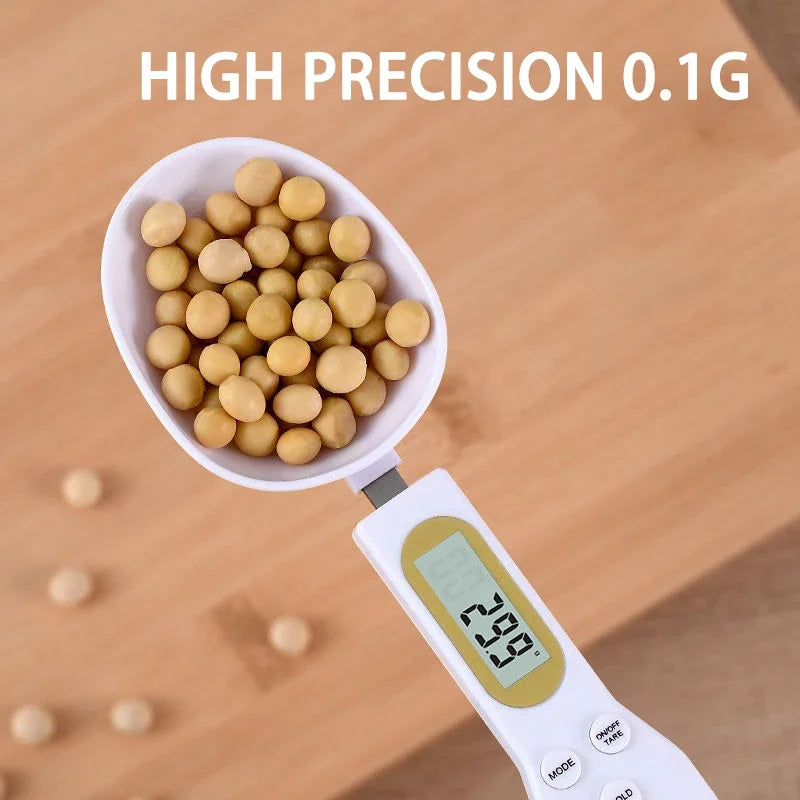 Digital 500g WinniHouse precision kitchen scale with LCD display, featuring a measuring spoon for accurate culinary measurements.