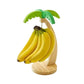 Wooden hanging kitchen shelf in banana shape by WinniHouse, featuring a natural finish and compact design for kitchen organization.