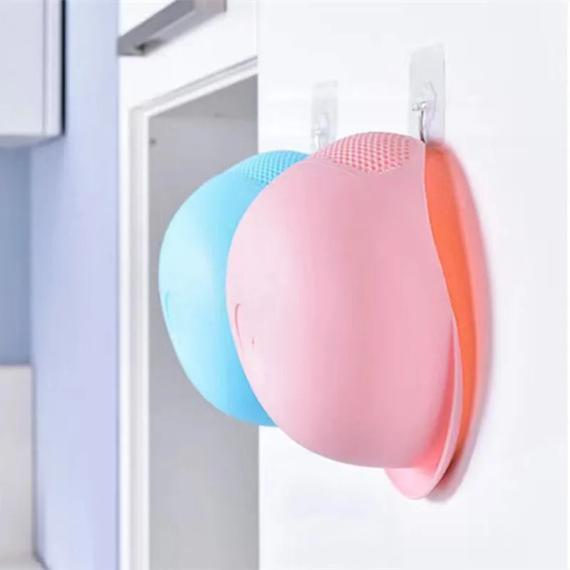 Plastic rice strainer from WinniHouse with handles, used for rinsing rice, fruits, and vegetables in the kitchen sink.