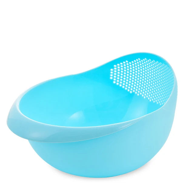 Plastic rice strainer from WinniHouse with handles, used for rinsing rice, fruits, and vegetables in the kitchen sink.