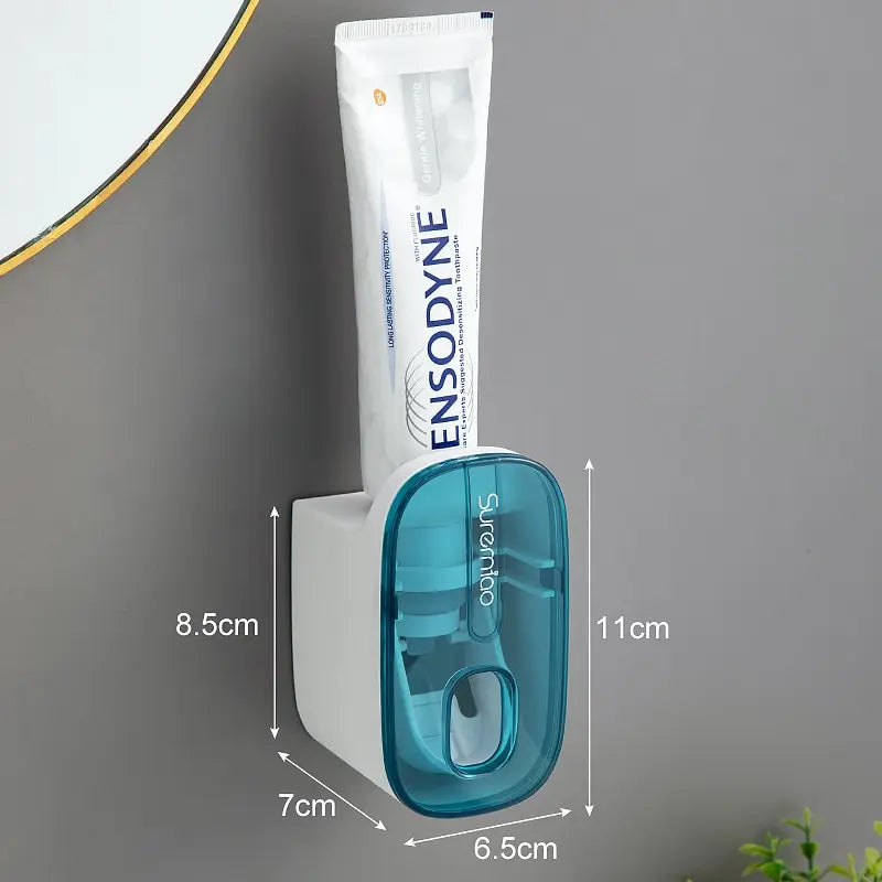 WinniHouse automatic toothpaste dispenser showing a sleek white device with a toothpaste tube ready for use
