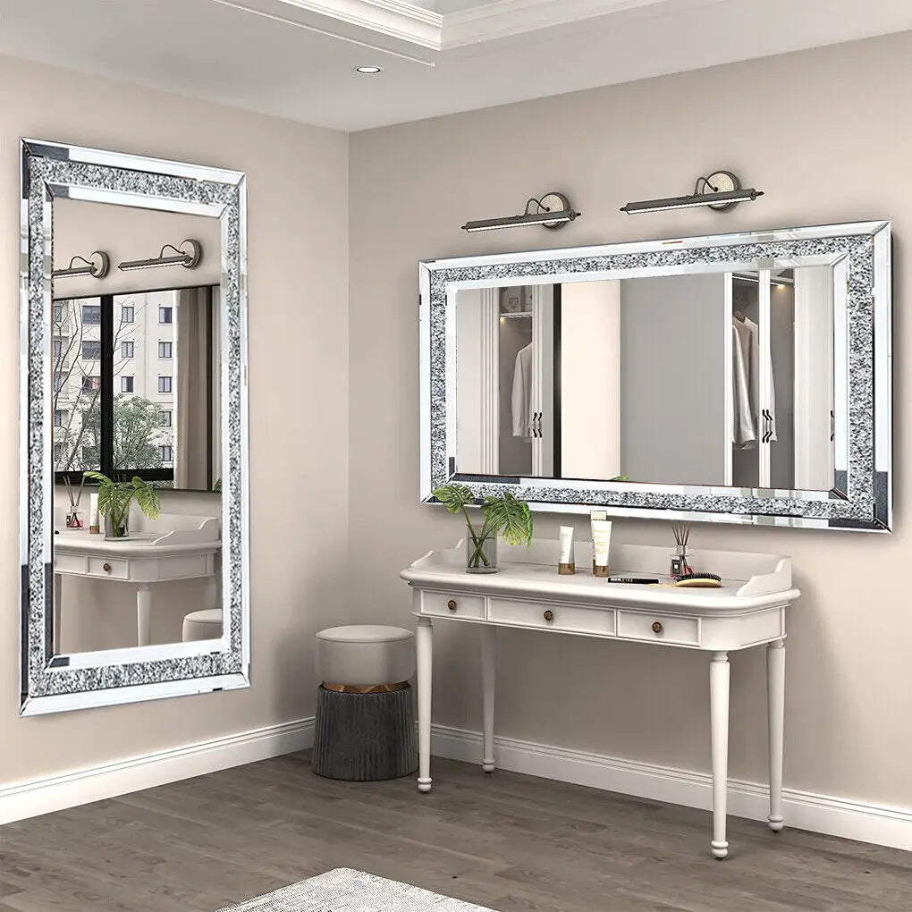 Large silver wall-mounted vanity mirror with sparkling crystal-like diamonds, frameless design for home or hotel decor.