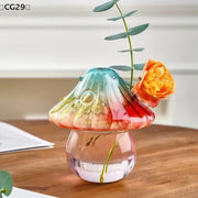 Colorful glass mushroom-shaped vase by WinniHouse, featuring vibrant hues and a whimsical, decorative design.