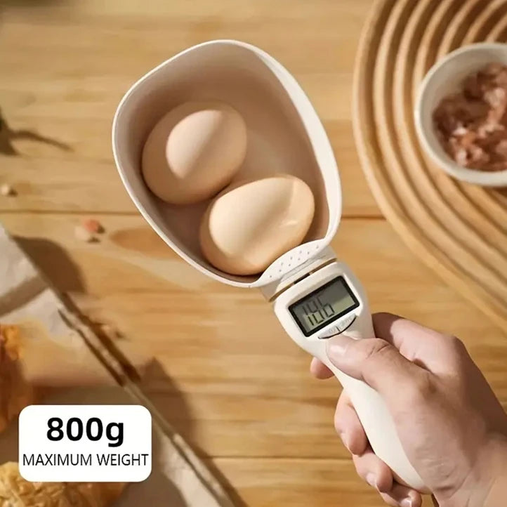 Digital food measuring spoon by WinniShop with built-in scale for measuring pet and baking ingredients like flour for cats and dogs.
