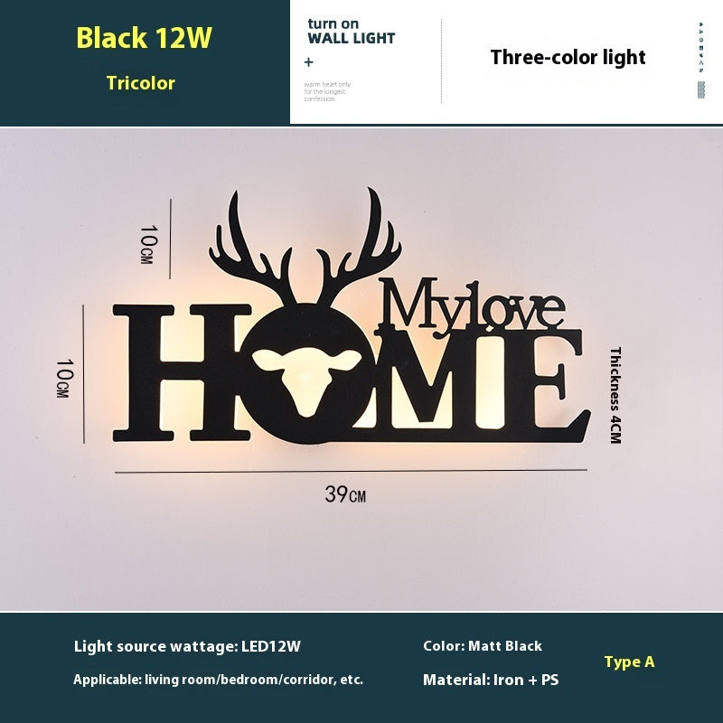 WinniHouse LED English letter wall lamp mounted on background wall, creative illuminated decor for modern interior design.