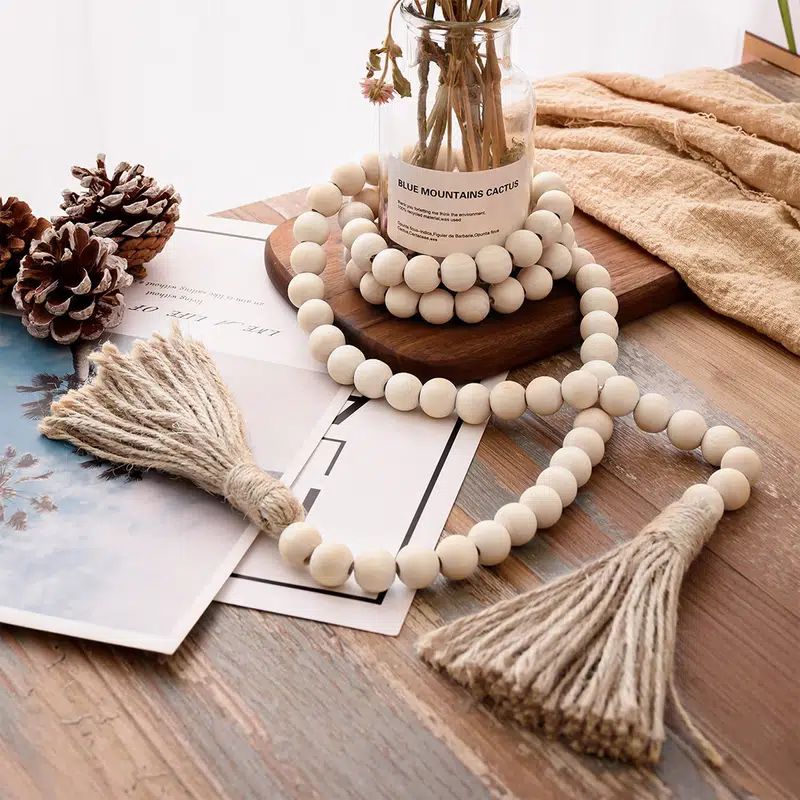 Wooden beads garland with tassels, 32 inches, rustic farmhouse decor for living room, coffee table, or festive spring celebrations.