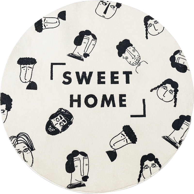 Modern black and white artistic round rug with abstract design, perfect for contemporary home decor.