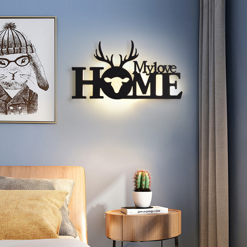 WinniHouse LED English letter wall lamp on background wall, creative lighting fixture for modern home decor.