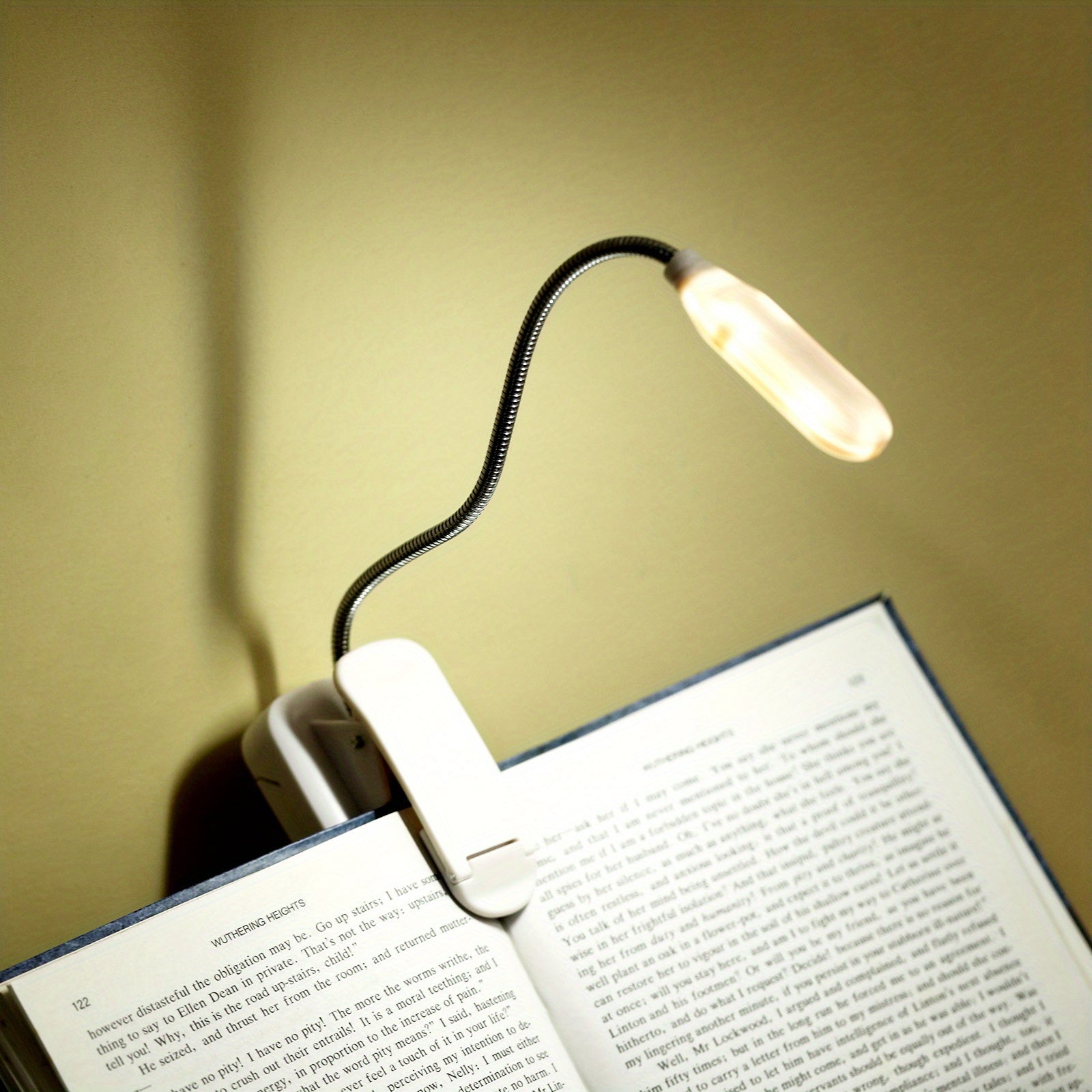 WinniHouse LED desk lamp with adjustable arm and clip, battery-powered, ergonomic design for reading and workspace illumination.