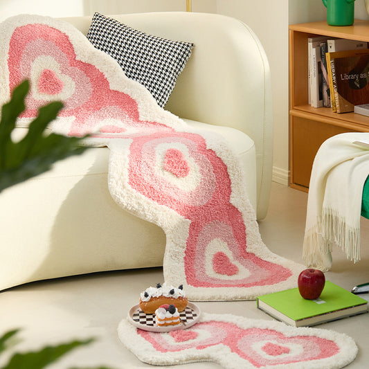 Soft pink heart-shaped shaggy rug from WinniHouse, plush and cozy, ideal for bedroom decor.