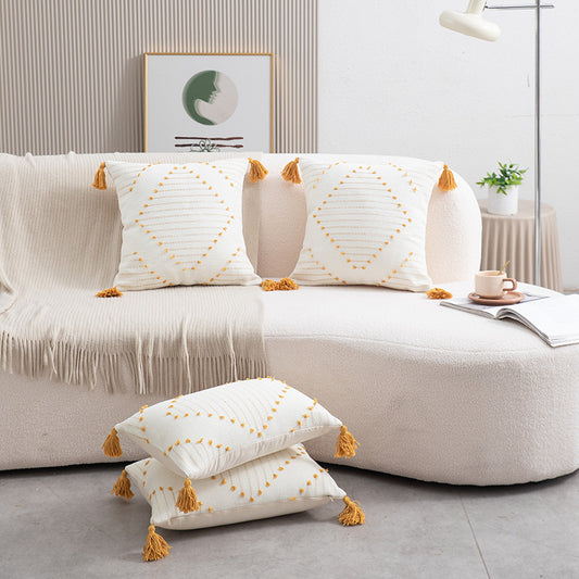 Boho cushion cover with tassels featuring geometric cotton design by WinniHouse, perfect for adding style to sofas or beds.