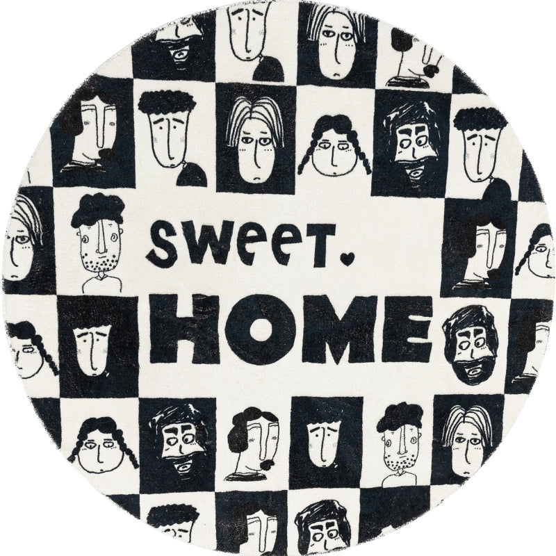 Round artistic rug in black and white with a modern illustrated design, perfect for contemporary home decor.